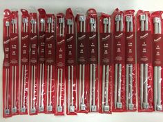 a bunch of red and white tools in packages