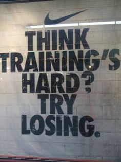 an advertisement on the side of a building that says think training's hard? try losing