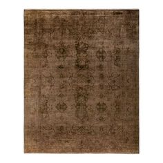 an antique rug with brown and beige colors