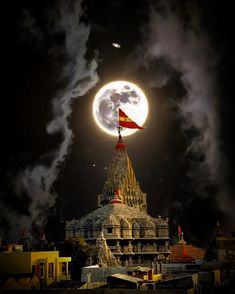 the full moon is seen over a temple in india