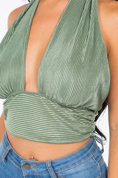 A crop top featuring a back-tie halter strap that crosses at the neck, fitted bodice, cropped length and luxe plisse fabrication.Fabric: 100% Polyester Made in: Los Angeles, USA Size Bust Waist Hips XS 32 24 - 25 33 - 34 S 34 - 35 26 - 27 35 - 36 M 36 - 37 28 - 29 38 - 40 L 38 - 39 30 - 31 42 - 44 V-neck Tie Back Halter Top For Night Out, Trendy Evening Halter Neck Top, Summer Evening Crop Top Halter Top, Summer Evening Halter Crop Top, Fitted Cropped Halter Top For Night Out, Trendy Strappy Halter Top For Night Out, Cropped Halter Top For Spring Evening, Spring Triangle Crop Top For Night Out, Chic Cropped Halter Top For Party