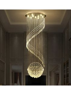 a modern chandelier hanging from the ceiling