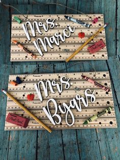 two wooden rulers with writing on them and pencils next to one that says mr and mrs