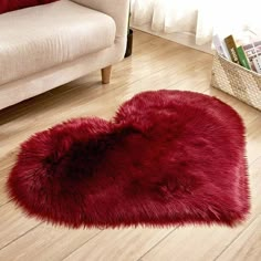 a red heart shaped rug on the floor