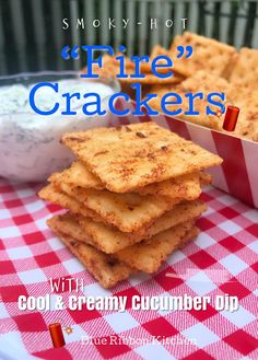 some crackers are on a red and white checkered table cloth