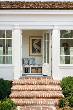 an entryway with steps leading up to the front door