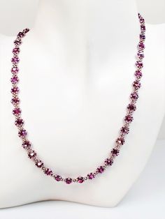 "Handmade beaded necklace featuring Preciosa Crystal bicones in Fuchsia AB and Smoky Amethyst AB glass seed beads woven into an elegant diamond-shaped chain, and finished with a Silver-plated lobster clasp. This dainty necklace is all sparkle, and it measures 18 inches in length with a 1-inch extender to 19 inches. Very versatile, can be worn for any occasion, formal or casual. Lightweight and easy to wear, this will soon become your favorite necklace. This necklace can be created in lots of col Fuchsia Necklace, Pink Bead Necklace, Vertical Bar Necklace, Woven Necklace, Beadwork Necklace, Aquamarine Necklace, Handmade Beaded Necklaces, Pink Beads, Bridal Necklace