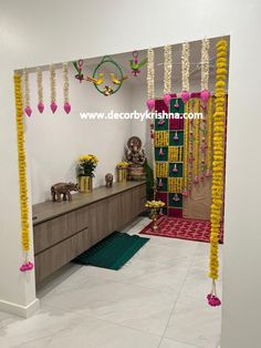 a room decorated with yellow and pink garlands