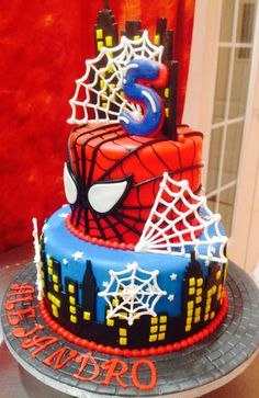 a spiderman birthday cake on a table