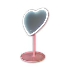 a heart shaped mirror on a pink stand