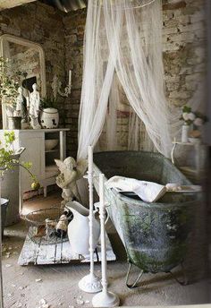 an old fashioned bath tub in a rustic bathroom