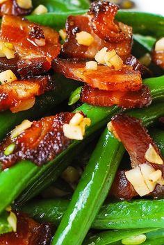 green beans, bacon and pine nuts are piled on top of each other