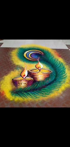 a colorful rangdi with two lit candles on the ground