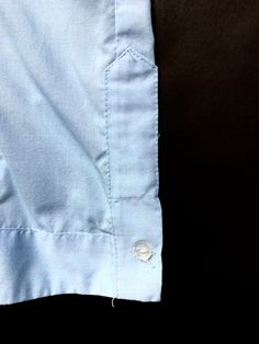 "Vintage Guayabera Loop Collar Shirt ~ estimated size L Color: Light to medium blue. Fabric: Not tagged. Either 100% cotton or a \"permanent press\" cotton blend. Condition: Excellent, gently worn condition. Size: Estimated size L. PLEASE OBSERVE THE MEASUREMENTS: Chest (underarm to underarm): 24\" Sleeve (shoulder to cuff): 25.25\" Shoulders (seam to seam): 20.25\" Length (neck seam to bottom hem): 29.5\" Shipping weight (includes packaging): 12 oz Please see our store policies for details on s Blue Cotton Blouse With Pockets, Blue Cotton Blouse With Placket, Light Blue Cotton Blouse With Pockets, Light Blue Embroidered Cotton Shirt, Light Blue Cotton Embroidered Shirt, Blue Cotton Blouse With Button Cuffs, Light Blue Cotton Blouse For Daywear, Guayabera Shirt, Camp Wedding