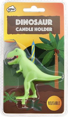 a dinosaur candle holder in the shape of a t - shirt