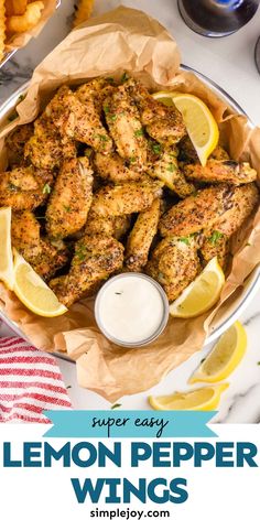 lemon pepper wings in a bowl with dipping sauce