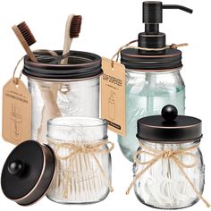 mason jars with toothbrushes, soap dispenser and other items in them