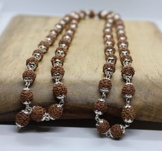 Welcome, Rudraksha Rudraksh 54 Bead Japa Mala 5 Facet Spritually Activated Beads with pure silver metal cap  Length Of Mala: 80 cm Size Of Beads : 6 mm Number Of Beads : 54 +1 With 92.5% sterling silver Metal cap 100% Original & Authentic ORIGIN :: India (The Holy Shrine)    We offer 100% Money Back, No Questions Asked. Bid with confidence. Rudraksh Mala, 5 Mukhi Rudraksha, Jhumka Designs, Rudraksha Mala, New Gold Jewellery Designs, 108 Mala Beads, Wrapped Necklace, Silver Caps, Wire Wrapped Necklace