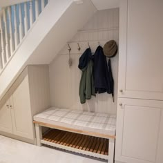 Built In Hall Tree and Cupboards in Under Stairs Space Under Stairs Hanging Storage, Under The Stairs Entryway, Hall Tree Under Stairs, Under Stair Entryway, Hall Under Stairs, Modern Under Stairs Storage, Understairs Hallway Ideas, Over The Stairs Closet Ideas, Hall Tree Staircase