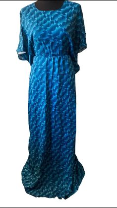 This is a Somali dress known as a bati, it's typically worn at home. It's soft and comfortable for lounging at home. Blue Casual Kaftan For Loungewear, Blue V-neck Kaftan For Loungewear, Casual Blue Kaftan For Daywear, Blue V-neck Lounging Dress, Blue Flowy Maxi Dress For Loungewear, Blue V-neck Maxi Dress For Loungewear, Baati Somali, Somali Baati, Somali Dress