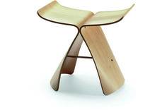 an unusual wooden stool with curved legs and wood grained edges, designed to look like a bird's - foot