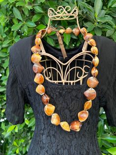 Unique vintage real brown shell necklace - perfect statement piece for any occasion! Some of the shells are worn (as seen in pictures), but in my opinion, that "imperfect" look just adds to the vintage look!  Measurements: (when tied) 16 inches long Siren Jewelry, Sea Siren, Shell Necklace, Look Vintage, Necklace Vintage, Shell Necklaces, Looks Vintage, Waist Belt, Vintage Look