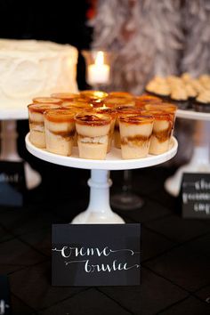 there are many desserts on the table at this wedding reception, and one is for sale