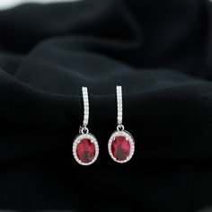 Product Details Upgrade your style with these elegant hoop drop earrings. They feature an oval-shaped Created Ruby solitaire set in a claw setting, surrounded by a halo of round-shaped Diamond stones. The Created Ruby center stone and the Diamond stones together create a beautiful harmony of color and sparkle, making them perfect for any occasion. Product Information SKU SHP-EARRINGS0621110186 Length 22 mm Width 7 mm Weight 2.97 gm (Approximate) LAB CREATED RUBY INFORMATION No.of Stones 2 Pieces Hoop Drop Earrings, Dangle Hoop Earrings, Claw Setting, Ruby Earrings, Dangly Earrings, Ruby Gemstone, Gold Drop Earrings, Diamond Halo, Gold Hoop