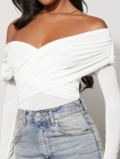 This gorgeous Off Shoulder Solid Colored Bodysuit is a must-have for your wardrobe. The white, sheer fabric cascades off the shoulders and is adorned with a criss-cross detail in front. The wrap-style bodice and long sleeves provide a slim, flattering fit that will hug your curves. The waistline is natural, creating a timeless look that you can wear to all your special occasions. Features: Color: White Pattern Type: Plain Neckline: Off the Shoulder Details: Criss Cross, Sheer, Wrap Sleeve Length Wrap Sleeve, Quinceanera Themes Dresses, Cowgirl Boots Outfit, Comfy Jumpsuits, Lantern Sleeved Blouses, Country Outfits, Lantern Sleeve, Lantern Sleeves, Black Bodysuit