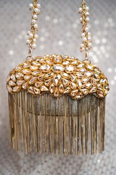 Gold potli with stone embellishment in tear drops pattern. Comes with detachable handle. - Aza Fashions Elegant Gold Potli Bag With Mirror Work, Elegant Celebration Potli Bag With Mirror Work, Gold Embellished Potli Bag For Reception, Gold Potli Bag With Mirror Work For Reception, Elegant Mirror Work Shoulder Bag, Luxury Hand Embellished Bags For Celebration, Elegant Shoulder Bag With Mirror Work, Elegant Embellished Shoulder Bag For Celebration, Glamorous Embellished Potli Bag For Reception