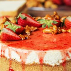 a cake with strawberries and walnuts on top