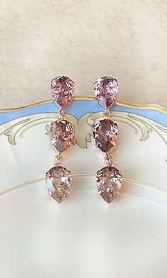 Gorgeous pair of earrings featuring 14x10mm Swarovski crystals in an ombré of blush.  Shown in the rose gold metal finish.  Post backs for pierced ears. Thanks for stopping by! Rose Gold Crystal Chandelier Drop Earrings, Rose Gold Crystal Chandelier Earrings, Rose Gold Crystal Chandelier Earrings For Party, Elegant Pink Teardrop Chandelier Earrings, Rose Gold Teardrop Earrings For Formal Occasions, Rose Gold Drop Jewelry For Party, Rose Gold Crystal Chandelier Dangle Earrings, Rose Gold Crystal Dangle Chandelier Earrings, Rose Gold Dangle Teardrop Earrings