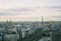 an aerial view of paris with the eiffel tower in the distance