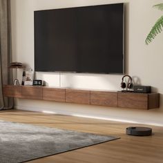 a flat screen tv mounted to the side of a wall