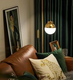 a living room filled with lots of furniture next to a painting on the wall and green curtains