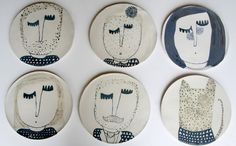 four plates with different designs on them