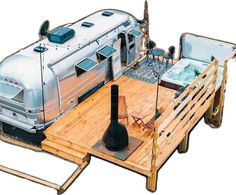 an rv is parked on the back of a trailer with a hot tub attached to it