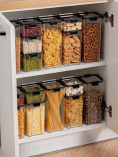 an organized kitchen cabinet filled with pasta and pretzels