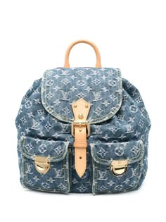 2003 pre-owned monogram denim backpack from Louis Vuitton Pre-Owned featuring indigo blue, cotton, calf leather, jacquard, monogram pattern, foldover top, buckle-strap fastening, drawstring fastening, single rolled top handle, two adjustable shoulder straps, two front flap pockets, internal logo patch, internal jetted pocket, full lining, gold-tone hardware, bucket body and circa 2003. Conscious: Purchasing this item continues its narrative and reduces the environmental impact of using new resou Louis Vuitton Vintage Bag, Louie Vuitton, Cute Mini Backpacks, Louis Vuitton Backpack, Denim Backpack, Pre Owned Louis Vuitton, Mini Backpacks, Lv Purse, Closet Organizer