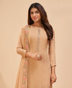 COLOR : Beige FABRIC : Top - Georgette, Inner & Bottom - Dull Santoon, Dupatta - Georgette WORK : Resham Embroidery, Thread Work, Foil Work, Zari, Sequins, Lace BorderOCCASION : Engagement, Party Wear, Festival READY-TO-WEAR : No STITCHING : Available as semi-stitched fabric, can be stitched using standard size option (+$20). Note: There might be a slight color variation due to lighting and flash used during photoshoot. The bright shade seen is the best closer view of fabric's color. Fitted Embellished Straight Kurta Dress, Formal Beige Georgette Sets, Fitted Beige Dress With Zari Work, Beige Georgette Long Sleeve Sets, Beige Semi-stitched Dresses, Beige Long Sleeve Georgette Sets, Fitted Beige Dress With Dupatta, Fitted Beige Sets With Dabka Work, Beige Fitted Sets With Dabka Work