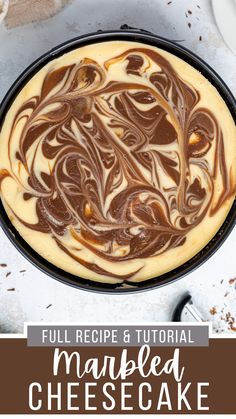 a cheesecake with chocolate swirl on top and the words, full recipe & video