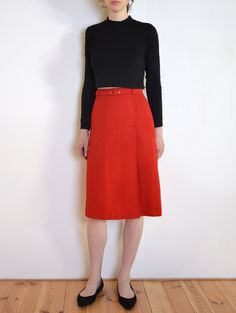 Beautiful vintage skirt  in a bright red tone. High waisted, flared midi fit, with an asymmetric pleat on the front. Belt loops and a belt made of the same fabric. The belt closes with red plastic buckle. Zipper and button closure on the back. Unlined. Era: 70's or early 80's, Sweden. Brand: Linberg and Webster AB Fabric: Texlene trevira Condition: very good, some minor signs of wear on the hidden part of the closure Estimated size: M (please, check the measurements) Measurements (measured flat, Red Tone, Skirt Medium, Vintage Rock, Vintage Skirt, Bright Red, Pleated Skirt, Poland, Really Cool Stuff, Vintage Inspired