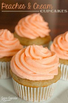 three cupcakes with pink frosting on a white plate and title reads peaches & cream cupcakes