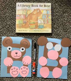 two books with bear pictures on them sitting next to a pen and paper cutout