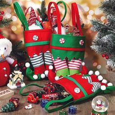 christmas stockings and other holiday decorations on a table