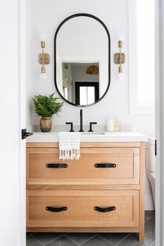 the instagram page shows an image of a bathroom vanity with a mirror above it