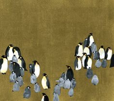 a group of penguins walking across a field