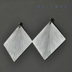 Monochromatic earrings made of silvery aluminum and silver. The sheet metal is repeatedly polished and engraved for the effect of light refracting in the watery tone. The earrings are toned and subtly shimmer like a sheet of water.  Studs are made of bright, satin 925 sterling silver. The width of the earrings is about 4,5 cm (ca. 1.77in). The earrings are about 5 cm (ca. 1.97in) long. The last photo shows an example of the packaging in which the jewelry is shipped. Silver Etched Metal Earrings, Etched Silver Metal Earrings, Handmade Silver Geometric Earrings, Silver Geometric Pierced Earrings, Aluminum Earrings, Engraved Earrings, Silver Pin, Geometric Form, Unique Handmade Jewelry