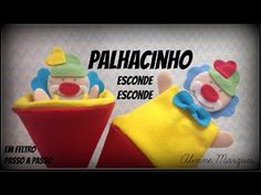 two stuffed clowns sitting next to each other on top of a red object with the words palhacinno