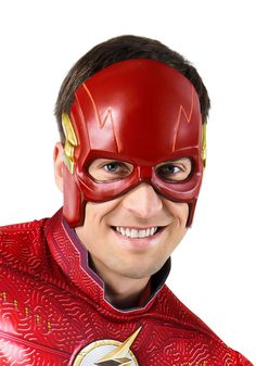 a man wearing a red flash mask and smiling